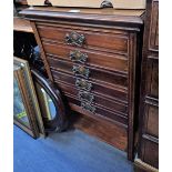 AN EDWARDIAN MAHOGANY SIX DRAWER MUSIC CABINET