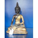 A BRONZE AND GILT BUDDHA,