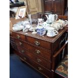 A GEORGE III OAK AND MAHOGANY CROSSBANDED CHET OF DRAWERS