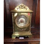 A LATE 19TH CENTURY BRASS CASED MANTEL CLOCK, OF ARCHITECTURAL FORM