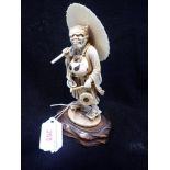 A FINELY CARVED JAPANESE IVORY FIGURE OF A 'MAN DEVIL'