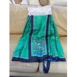 AN ORIENTAL EMBROIDERED SILK SKIRT