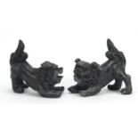 Pair of Chinese patinated bronze Foo dogs, each 15cm in length : For Further Condition Reports