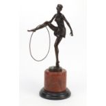 Patinated bronze study of an Art Deco semi nuder performer, raised on a marble base, 48cm high : For