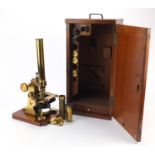 Victorian brass microscope with accessories and case by J & C Arobbins of London, 34.5cm high :