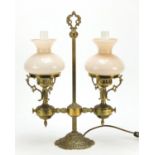 Ornate brass two branch oil lamp with glass shades, converted to electric use, 44cm high : For