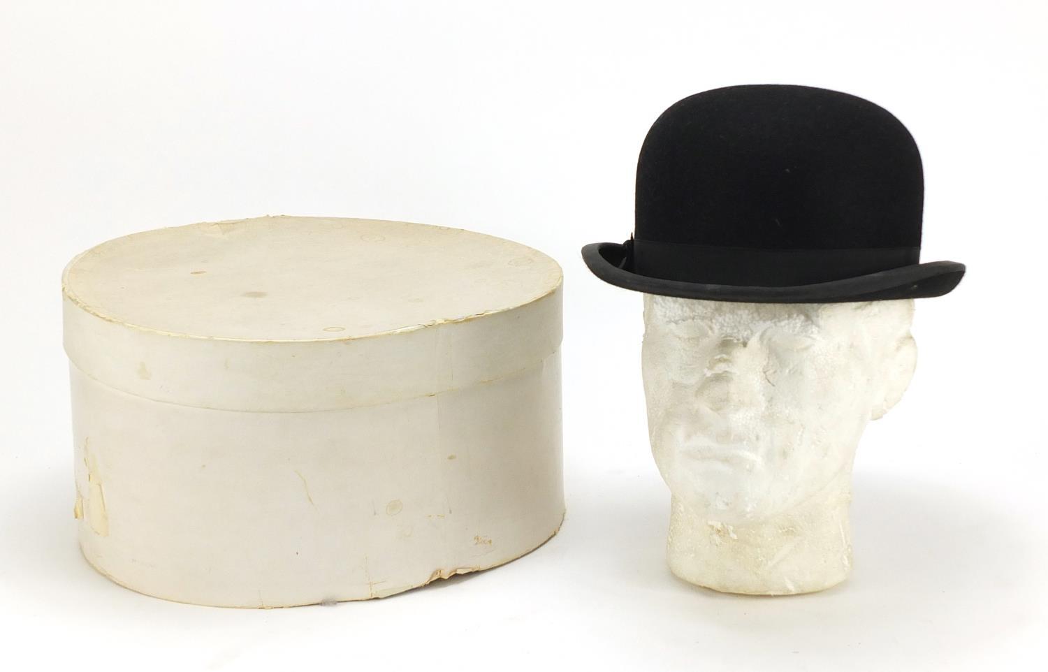 Gentleman's bowler hat retailed by Lock and Co, London, with box, the interior measurements, 21cm