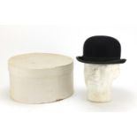 Gentleman's bowler hat retailed by Lock and Co, London, with box, the interior measurements, 21cm