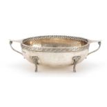 Arts & Crafts silver twin handled bowl by Albert Edward Jones, with pierced rim, planished body