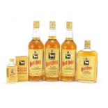 Five bottles of vintage White Horse Whisky, one with box, comprising sizes 75.7cl, 75cl, 37.5cl