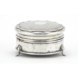 Circular silver jewel box raised on three feet W G S & Co, Birmingham 1915, 8.5cm in diameter, 127.