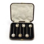 Set of six silver coffee bean spoons housed in a fitted case by Adie Brothers, Birmingham 1925, 9.