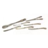 Silver handled glove stretchers, shoe horn and butter knives, various hallmarks, the largest 25cm in