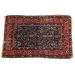 Red and blue ground geometric pattern rug, 145cm x 90cm : For Further Condition Reports Please Visit