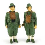 Two decorative figures of Laurel and Hardy in Military uniform, 33cm high : For Further Condition