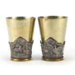 Pair of silver plated and copper beakers, relief decorated with ducks and partridges, 12cm high :