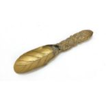 Japanese brass naturaliistic scoop, the handle embossed with insects amongst flowers, 20cm in length