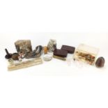 Objects including an antique brass fishing reel, enamelled classic car pins, vintage chocolate