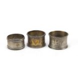 Three circular silver napkin rings, various hallmarks, 77.4g : For Further Condition Reports