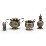 Silver objects comprising twin handled sugar bowl with matching milk jug, baluster shaped caster and