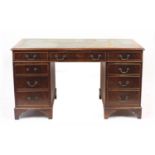 Mahogany twin pedestal desk fitted with an arrangement of nine drawers, 78cm H x 138cm W x 69cm