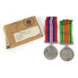 Two British military World War II medals with box of issue : For Further Condition Reports Please