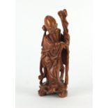 Chinese root carving of an elder holding a staff, 23cm high : For Further Condition Reports Please