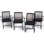 Set of four black reception chairs with mesh backs, 83cm high : For Further Condition Reports Please