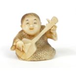 Japanese carved ivory Netsuke of a musician, signed to the base, 3.5cm high : For Further