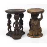 Two African tribal carved wood stools with beadwork, the largest 41cm high x 31.5cm in diameter :