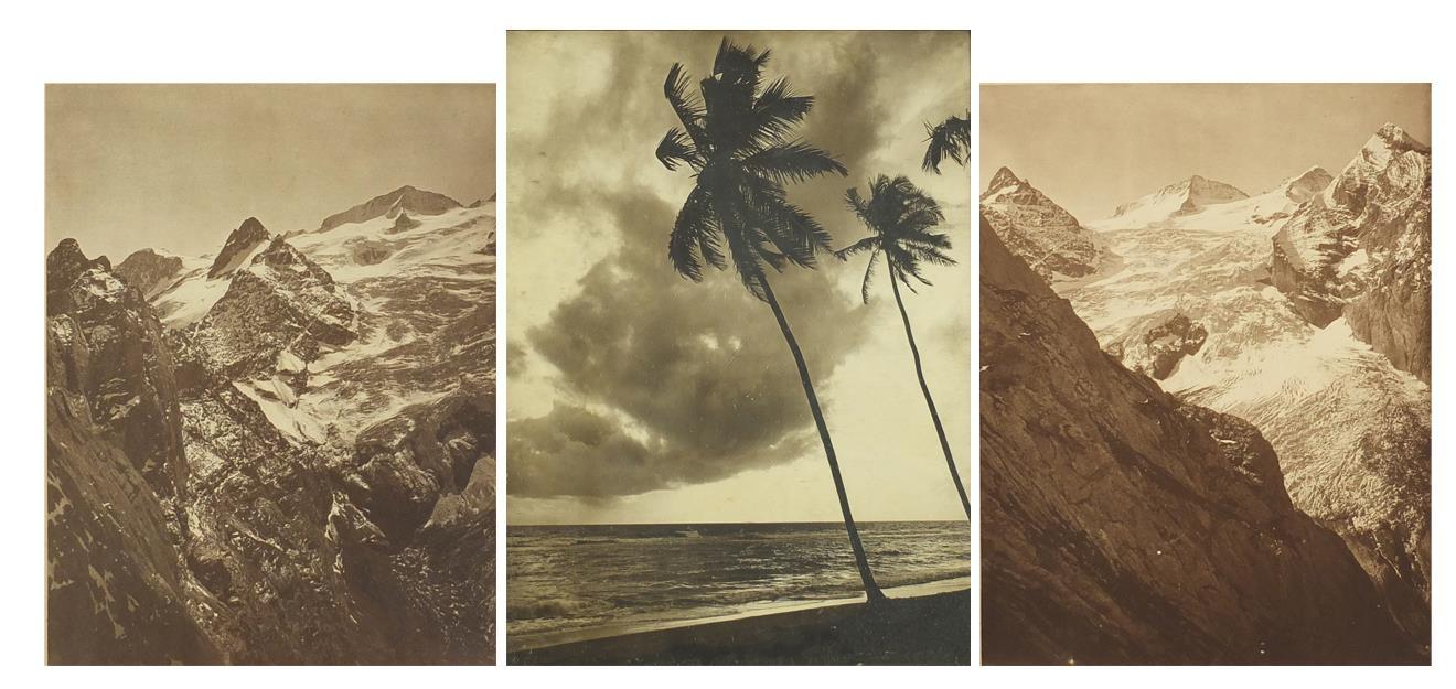 Two black and white photographs of snow covered mountains and a coastal view, each framed, the