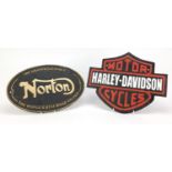 Two motorcycle advertising cast iron plaques - Norton and Harley Davidson, the larger 33cm in length