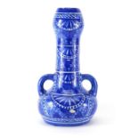 Islamic pottery vase with twin handles, hand painted with stylised flowers, 32cm high : For