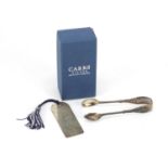 Pair of Victorian silver sugar tongs by William Comyns and a silver book mark by Carrs : For Further