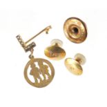 Gold jewellery comprising a pair of 15ct gold studs, 9ct gold stud and a 9ct gold gemini pendant,