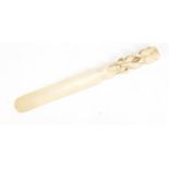 19th century ivory page tuner, finely carved with a flower, 20cm in length : For Further Condition