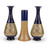 Three Royal Doulton stoneware vases including a pair hand painted with flowers, numbered 8334,