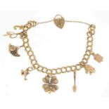 9ct gold charm bracelet with gold charms including a four leaf clover, 22.4g : For Further Condition