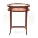 Oval inlaid mahogany bijouterie table with bevelled glass top, 76cm H x 59cm wide x 47cm D : For