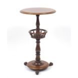 Victorian turned mahogany occasional table with galleried centre tier, 69cm high by 40cm in diameter