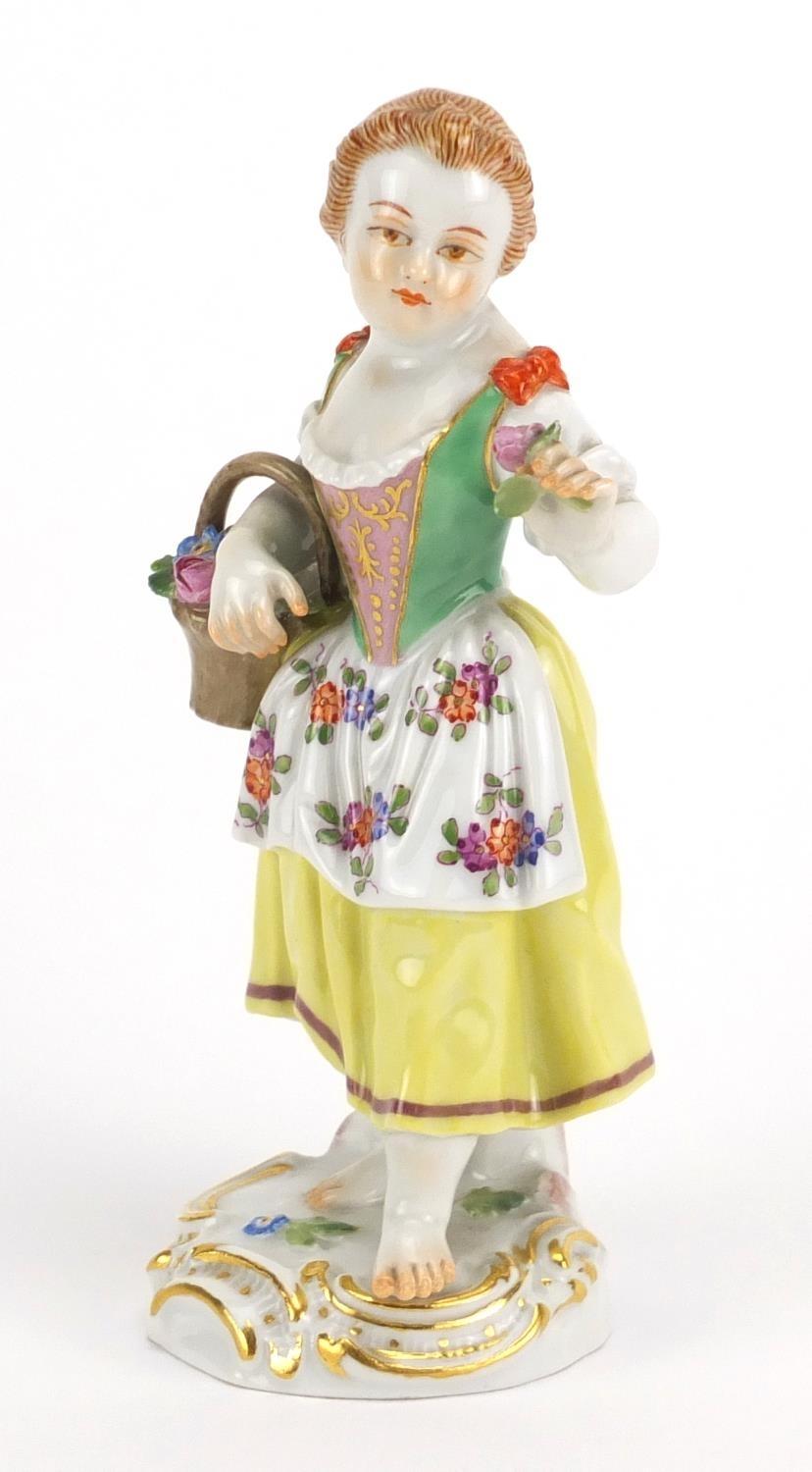 19th century Meissen porcelain figurine of a girl holding a basket of flowers, blue cross sword