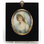 19th Century oval hand painted portrait miniature of a young female, housed in an ebonised frame,
