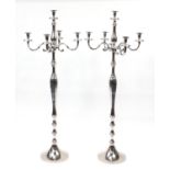 Pair of floor standing chromed five branch candelabras, each 49cm high :For Further Condition