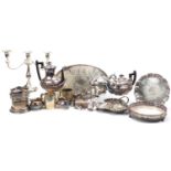 Silver plate including a three branch candelabra, tea pot, trays and a salver, the largest 29cm high