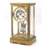 19th century French brass cased four glass mantle clock with a Brocot escapement and enamelled dial,