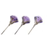 Three matching Art Nouveau silver and amethyst hat pins by Charles Horner, Chester 1918, the largest