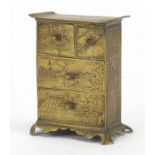 Japanese bronze chest of small proportions, finely engraved with birds of paradise and buildings,