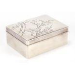 Japanese silver cigarette box, the lift off lid engraved with prunus flowers, impressed character