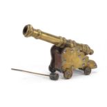 Antique brass table cannon and carriage, 24.5cm in length :For Further Condition Reports Please