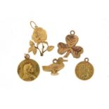 Five 9ct gold charms including St Christoper and a duck, 5.3g :For Further Condition Reports